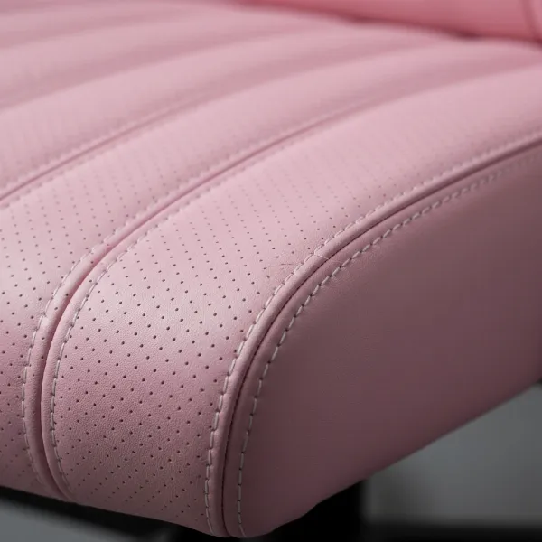 Close-up of a pink gaming chair's material, highlighting its texture and stitching for durability.
